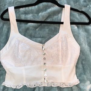 White lace Free People crop top with button front.